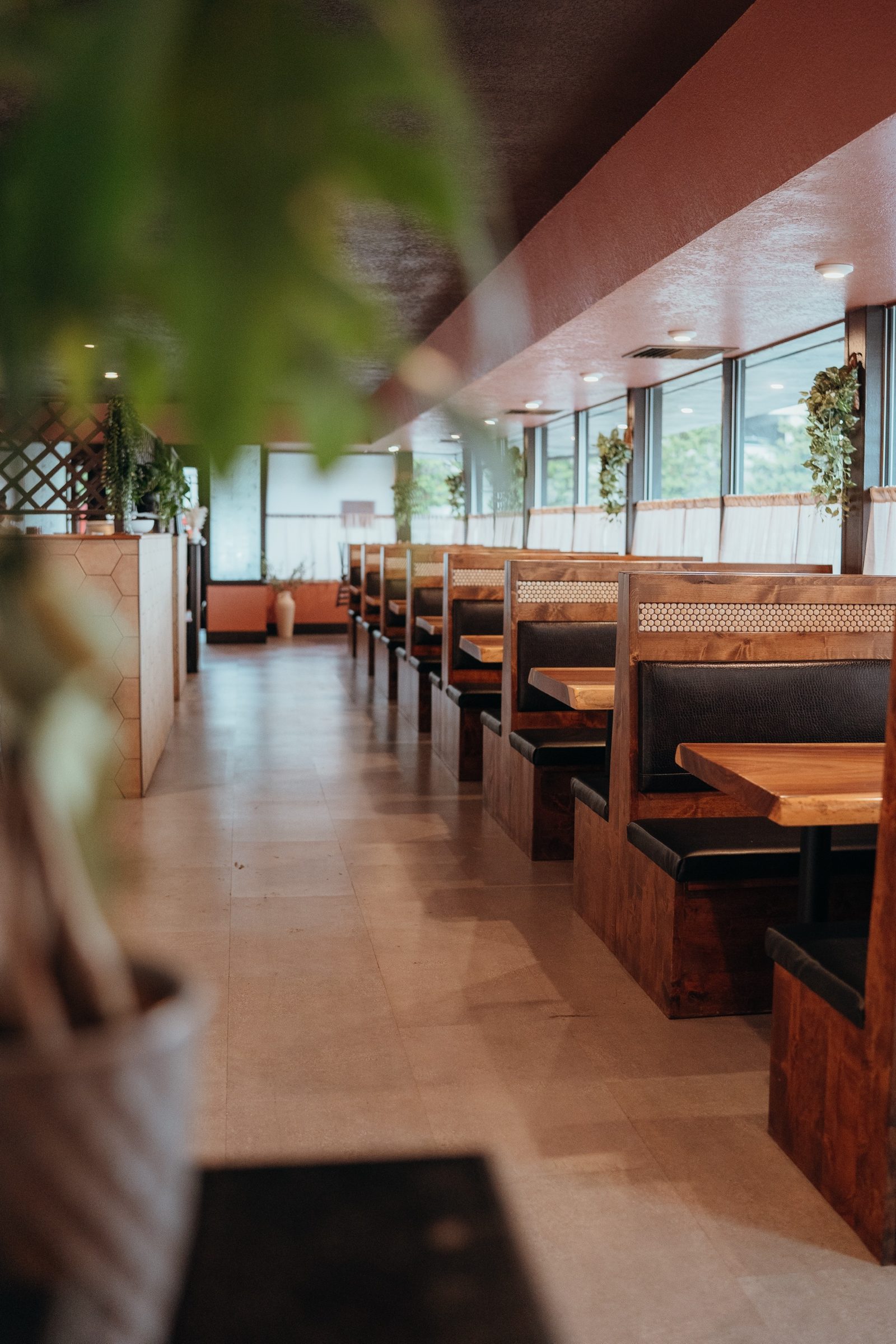 Canela's dining room with warm wood booths