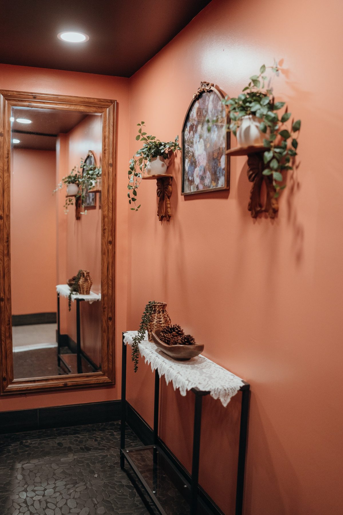Canela's hallway with warm terracotta walls